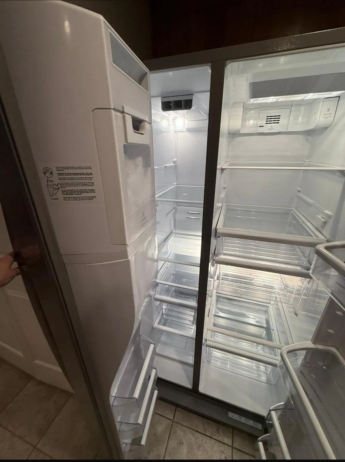 Clean, empty refrigerator with spotless shelves and drawers